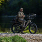 MOVE Electric Scooters - Young Electric E-Explorer Electric Hunting Bike man resting on his e-bike in a rocky road near a riverbank