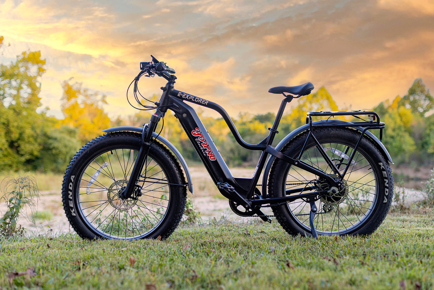 MOVE Electric Scooters - Young Electric E-Explorer Electric Hunting Bike in a grassy plain near a riverbank