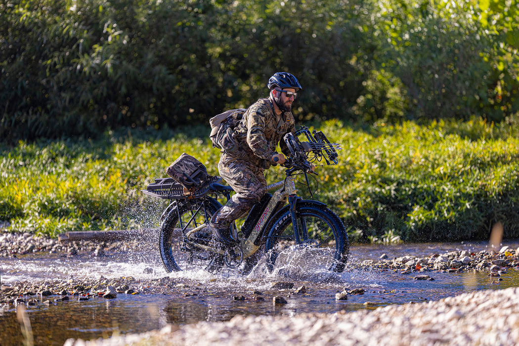 MOVE Electric Scooters - Young Electric E-Explorer Electric Hunting Bike lifestyle man rding his e-bike in a shallow river