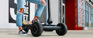 MOVE Electric Scooters - Cycle Board Rover 3-Wheel Electric Scoooter lifestyle with a persion riding the e-scooter